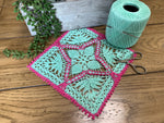 Load image into Gallery viewer, 8” Square Dimensional Crocheted Doily- Mint Green with Green with Magenta Accents
