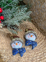 Load image into Gallery viewer, Set of 2 Snowman Head Ornaments – Rustic Resin with Blue Bow &amp; Santa Hat
