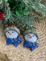 Load image into Gallery viewer, Set of 2 Snowman Head Ornaments – Rustic Resin with Blue Bow &amp; Santa Hat
