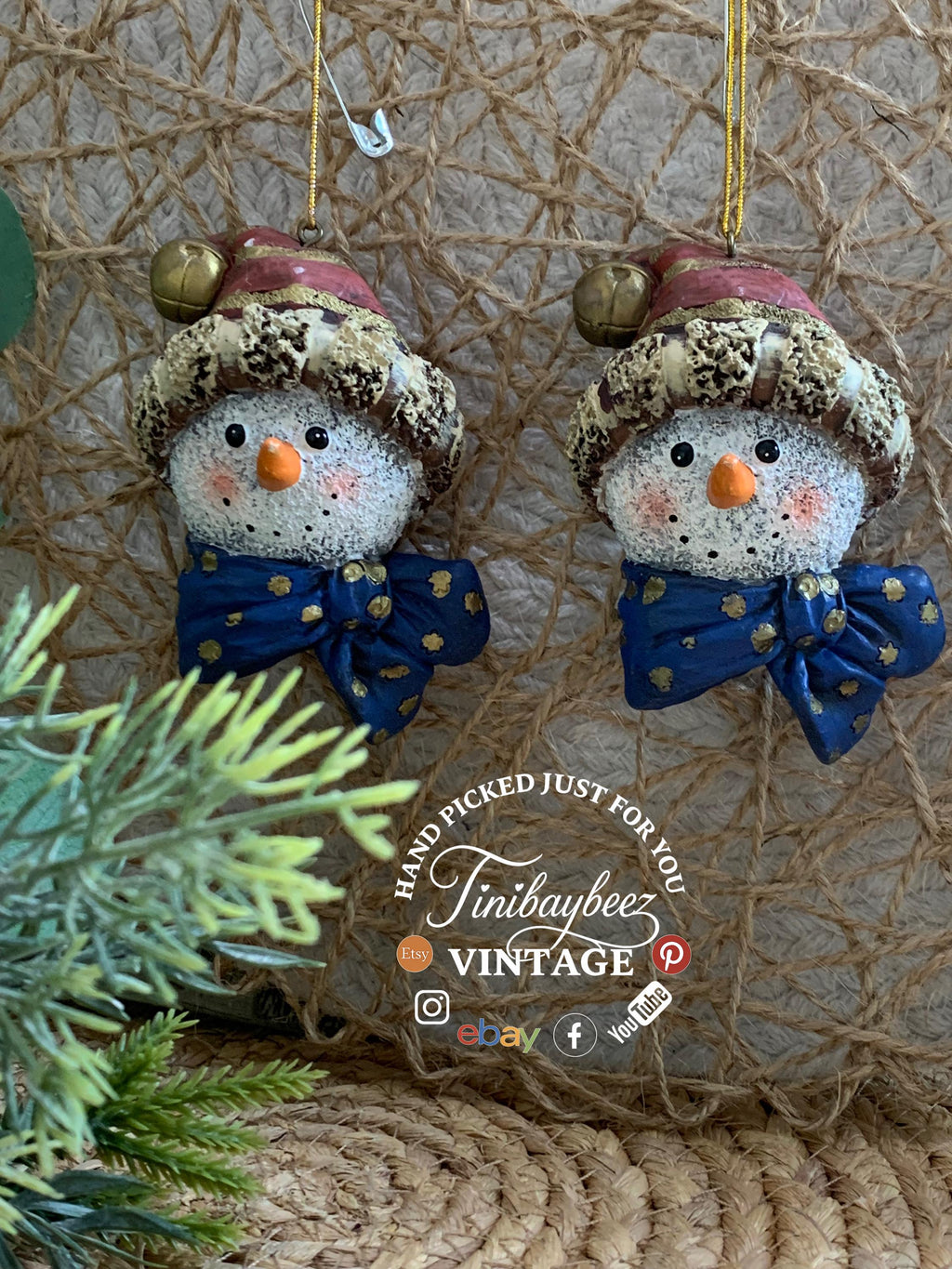 Set of 2 Snowman Head Ornaments – Rustic Resin with Blue Bow & Santa Hat