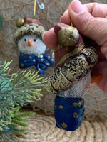 Load image into Gallery viewer, Set of 2 Snowman Head Ornaments – Rustic Resin with Blue Bow &amp; Santa Hat
