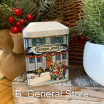 Load image into Gallery viewer, Vintage Tin Box Company Christmas Village Tins – Set of 4 (Toy Store, Snowy Creek Public School, Red Brick Schoolhouse, General Store)
