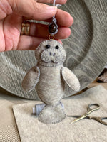Load image into Gallery viewer, Handmade Felt Manatee Ornament - Car Rearview Mirror or Purse Charm
