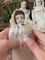 Load and play video in Gallery viewer, Set of 3 Porcelain Hanging Dolls – Vintage-Style Decorative Reproduction Dolls
