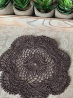Load and play video in Gallery viewer, 7 1/2”  Textured Crochet Doily - Charcoal Gray Lace Centerpiece
