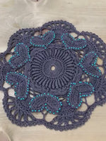 Load and play video in Gallery viewer, 8” Charcoal Gray Crochet  Heart Doily with turquoise bead accents
