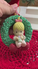 Load and play video in Gallery viewer, 1896 Previous Moments Enesco 3” Baby Girl with Bottle in a Wreath Ornament
